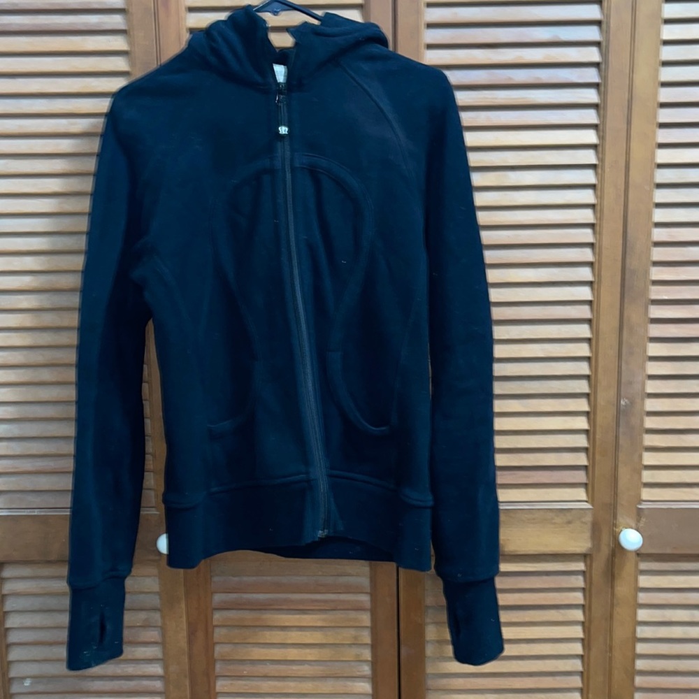 Lululemon black jacket with hood and logo.zipper front two front pockets